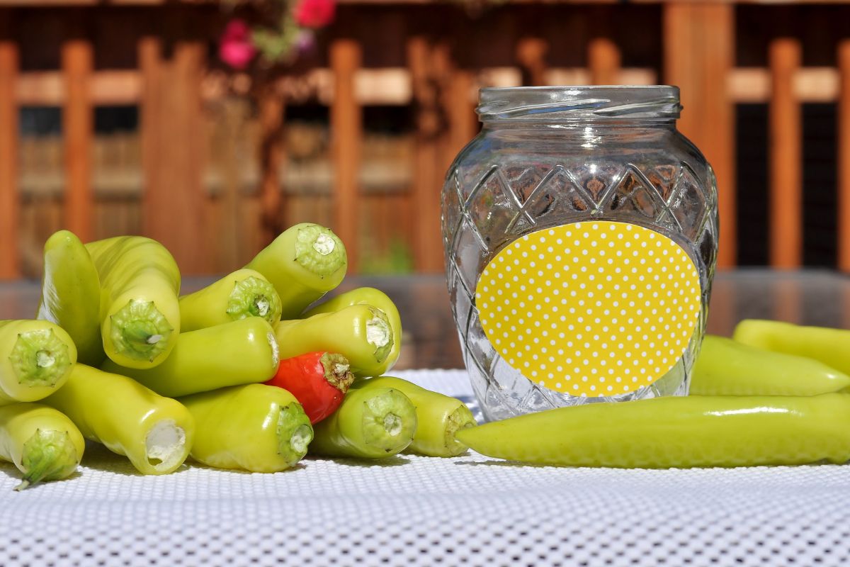 Banana peppers with a canning jar