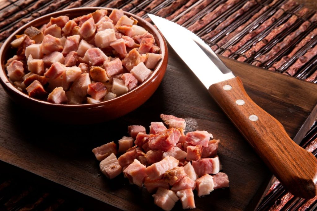 Diced pork meat in cubes smaller than one inch.