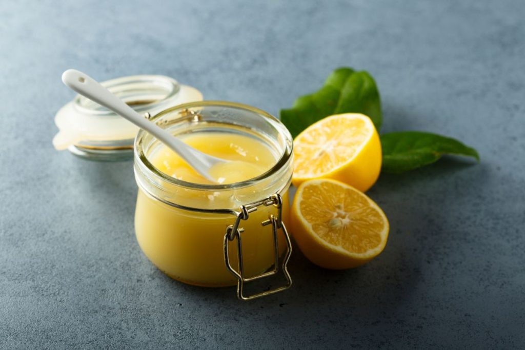 Open jar of home canned lemon curd