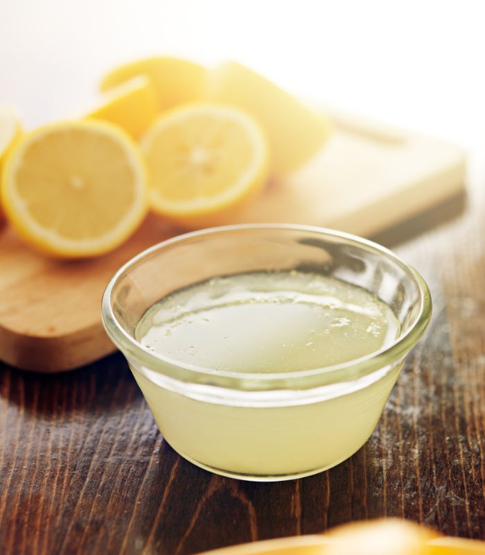 Freshly squeezed lemon juice in a bowl on a table