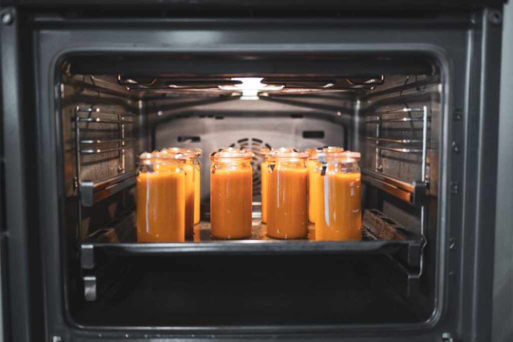 Canning jars placed inside oven