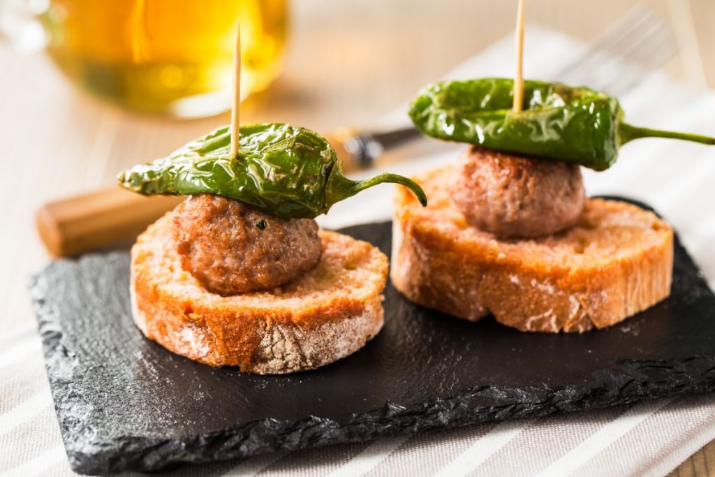 Mini meatloaf appetizers on bread with pickled jalapenos