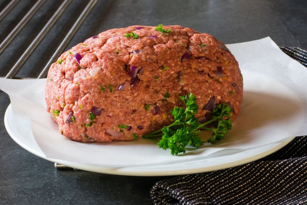Raw meatloaf on a plate