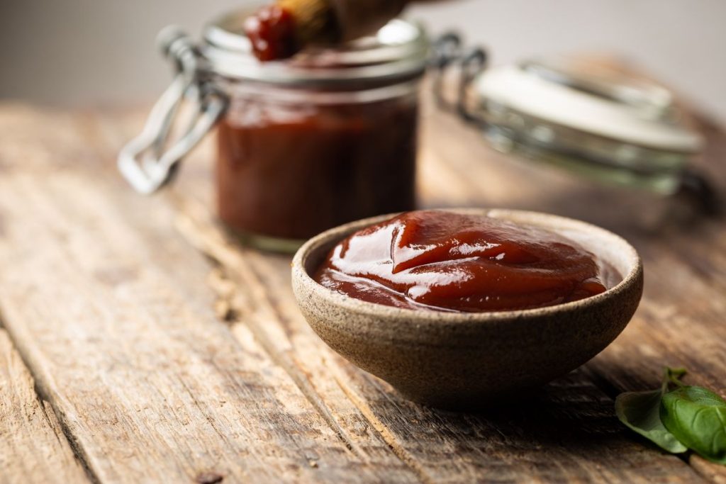 Small bowl with 1/4 cup of homemade bbq sauce inside