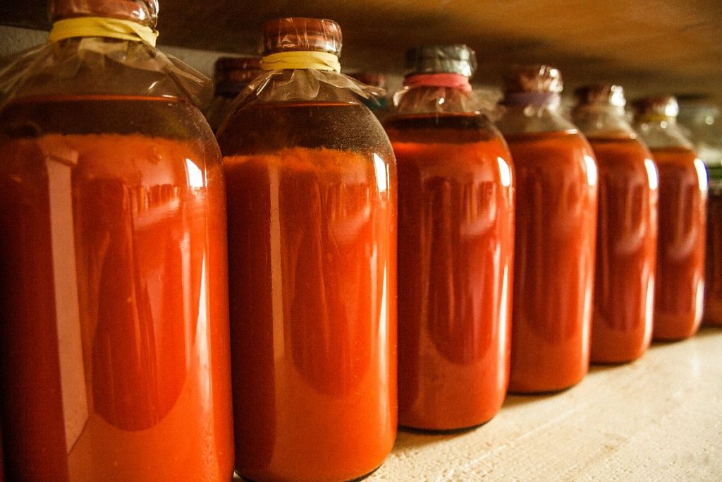 Canned tomato juice jars in storage