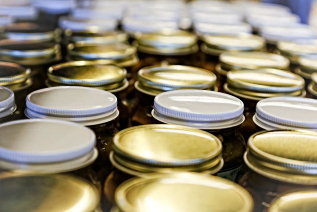 Canning lids that are indented and sealed