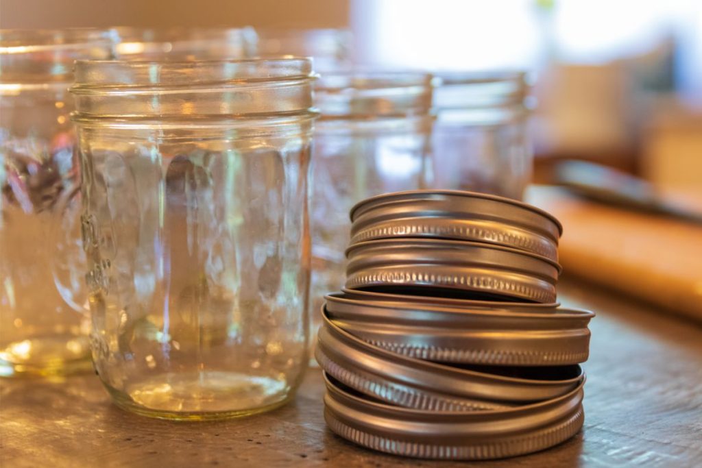 Pint jars with screw bands on a table