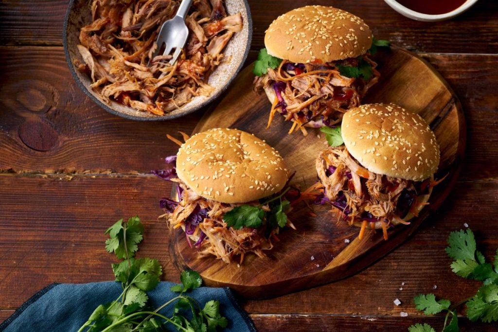 Pulled pork sandwiches on cutting board