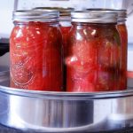 Mason jars full of stewed tomatoes