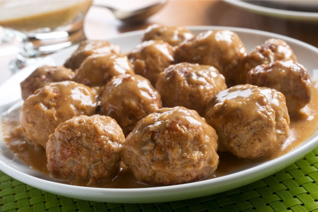Swedish meatballs with brown gravy on a plate
