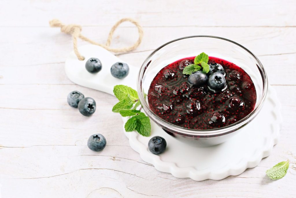 Blueberry preserves in a bowl mixed with chia seeds