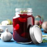 pickled beets in a jar with the lid off