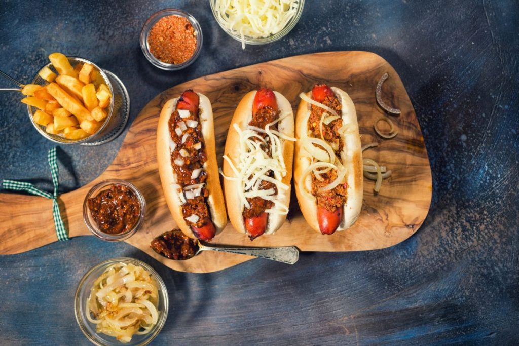 Platter of hot dogs with chili and onions