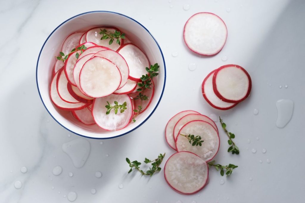 Quick pickled radishes in bowl