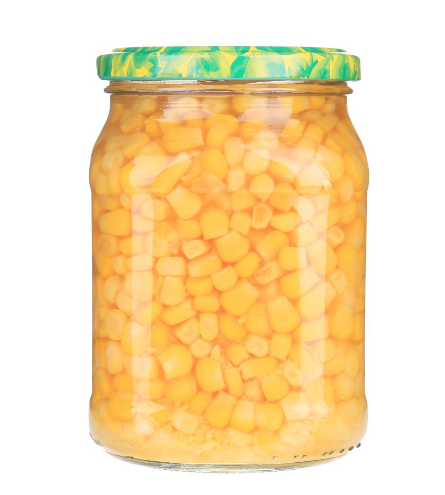 Sealed canning jar of canned corn kernels