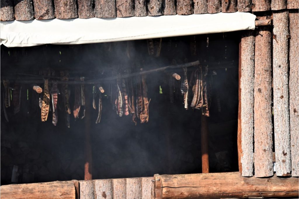 Salmon hanging in smoke house