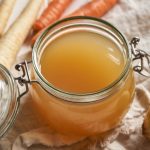 Open jar of home canned beef broth