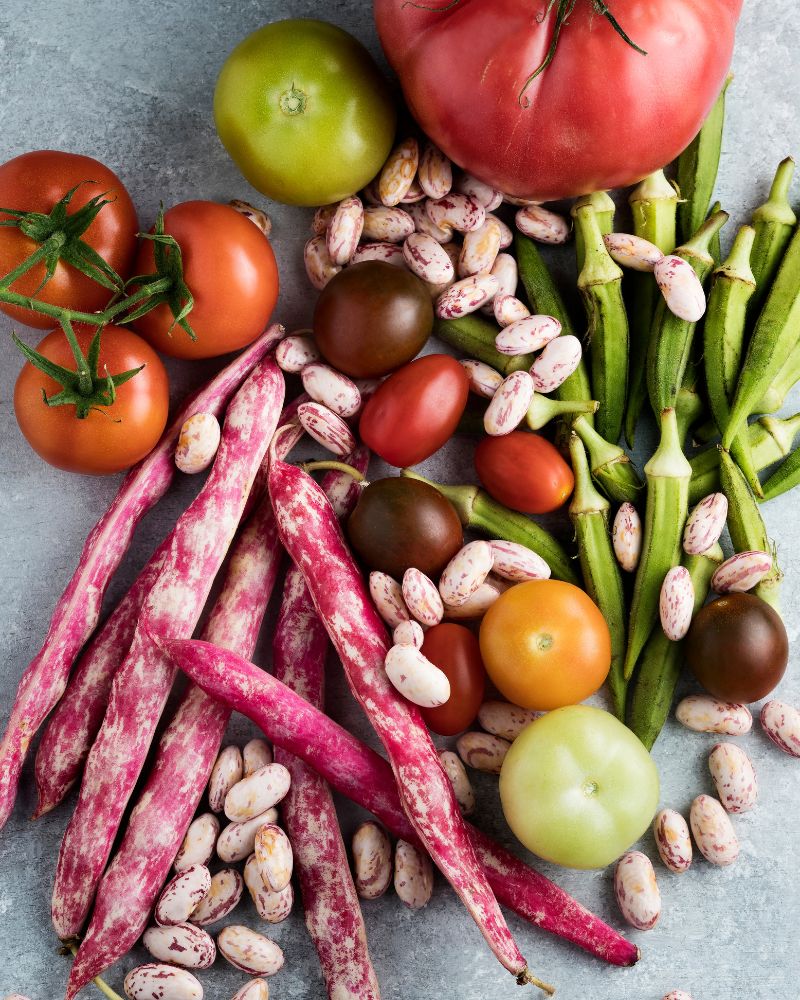 Gumbo ingredients including beans, green tomatoes, and okra