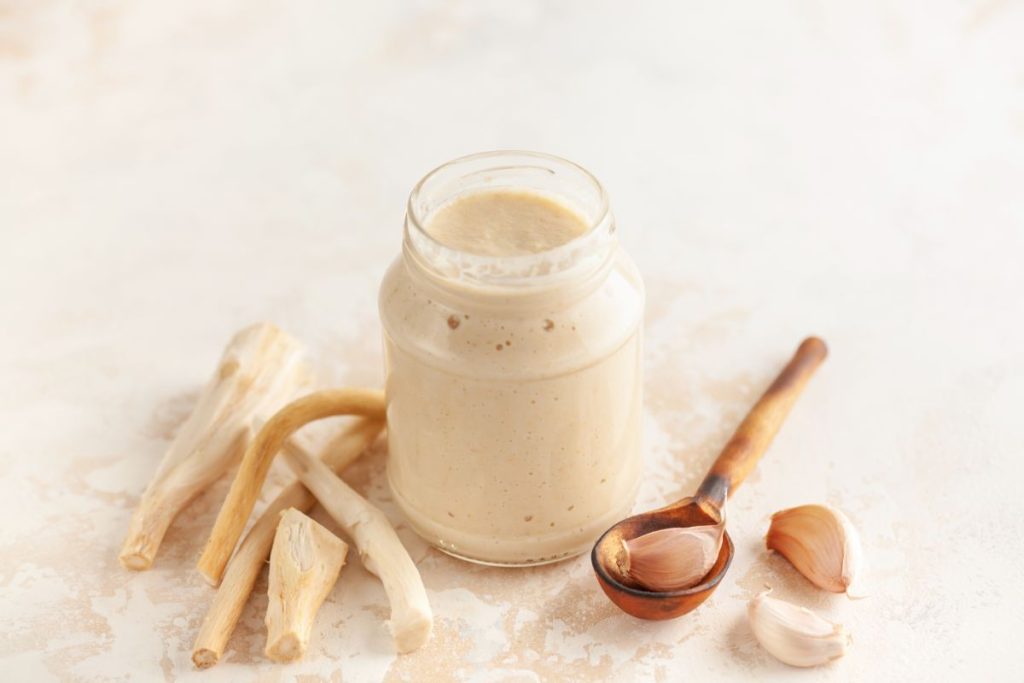 Open jar of horseradish sauce