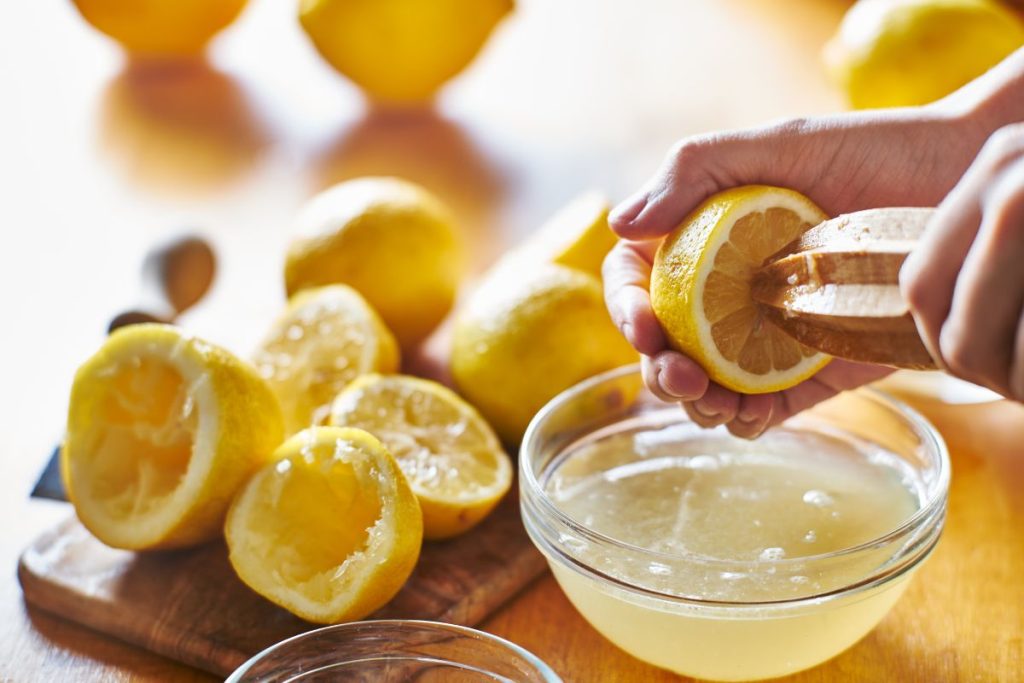 Fresh lemon juice being juiced