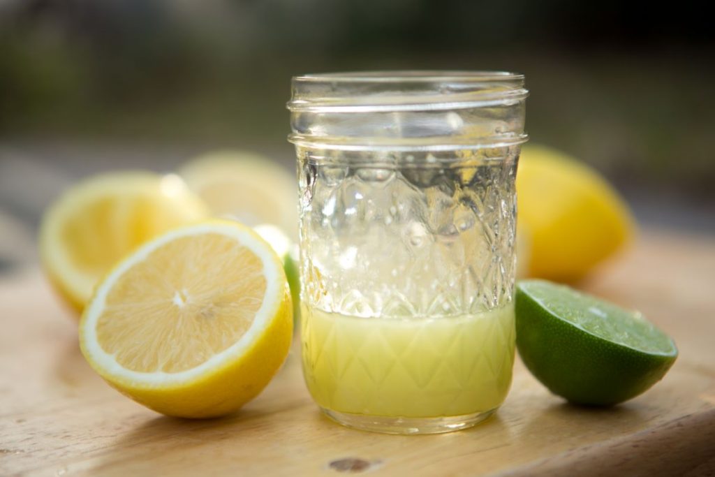 Jar of lemon and lime juice from fresh squeezed limes and lemons