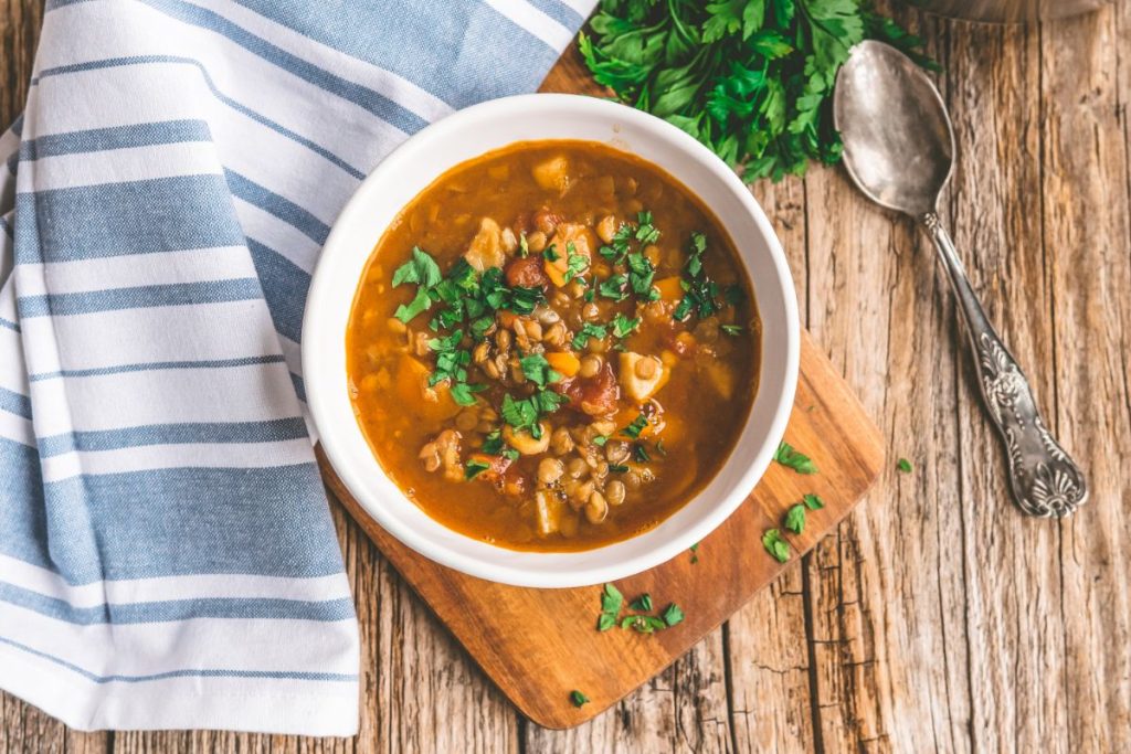 Lentil soup topped with fresh herbs