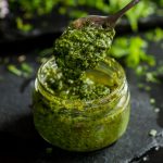 Spoonful of pesto from a jar