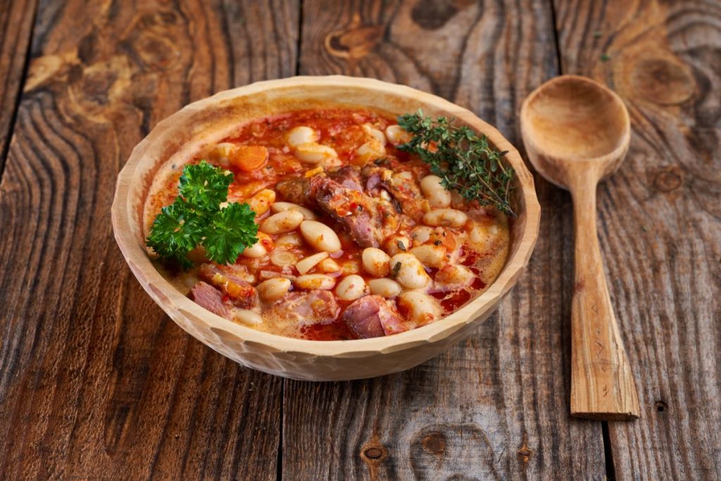 Bowl of old fashioned pork and beans made with butter beans