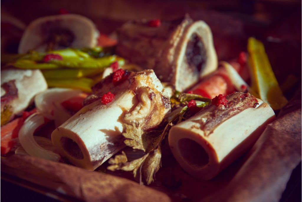 Bones, herbs, vegetables and seasonings in a pile