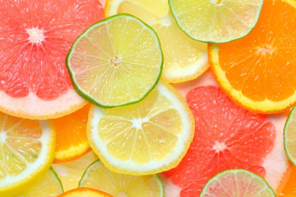 Lemon, lime, orange, and grapefruit slices laid on top of one another