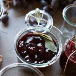 Canned grapes in open Mason jar