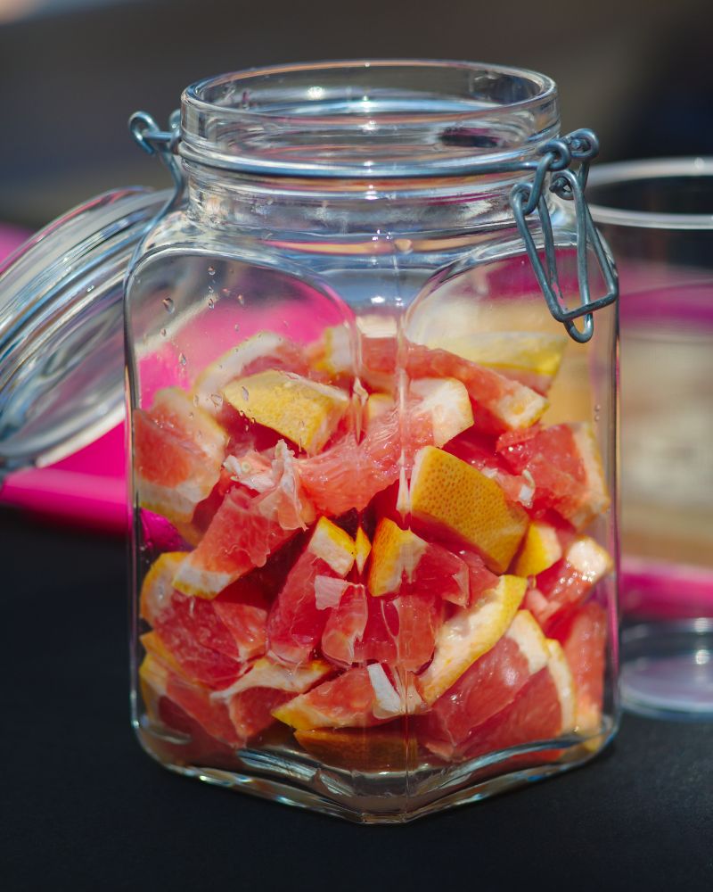 Raw-packed grapefruit pieces in a canning jar with no liquid