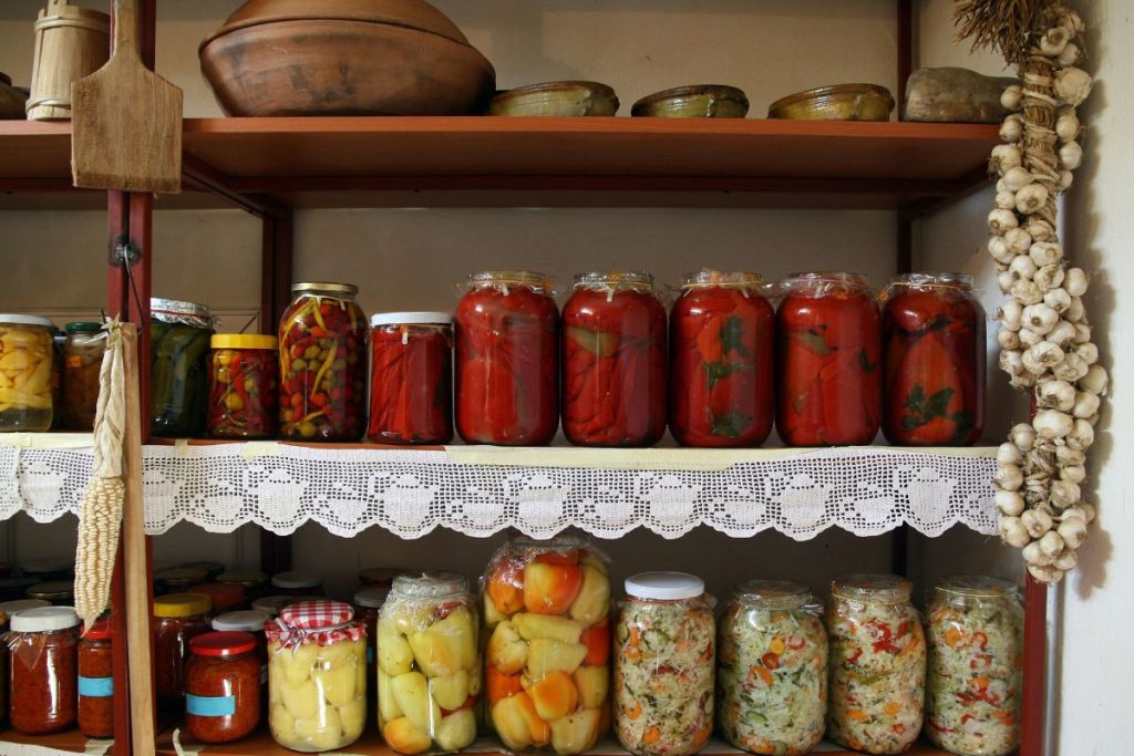 Pantry of canned goods, organized by placing the same types of items next to each other