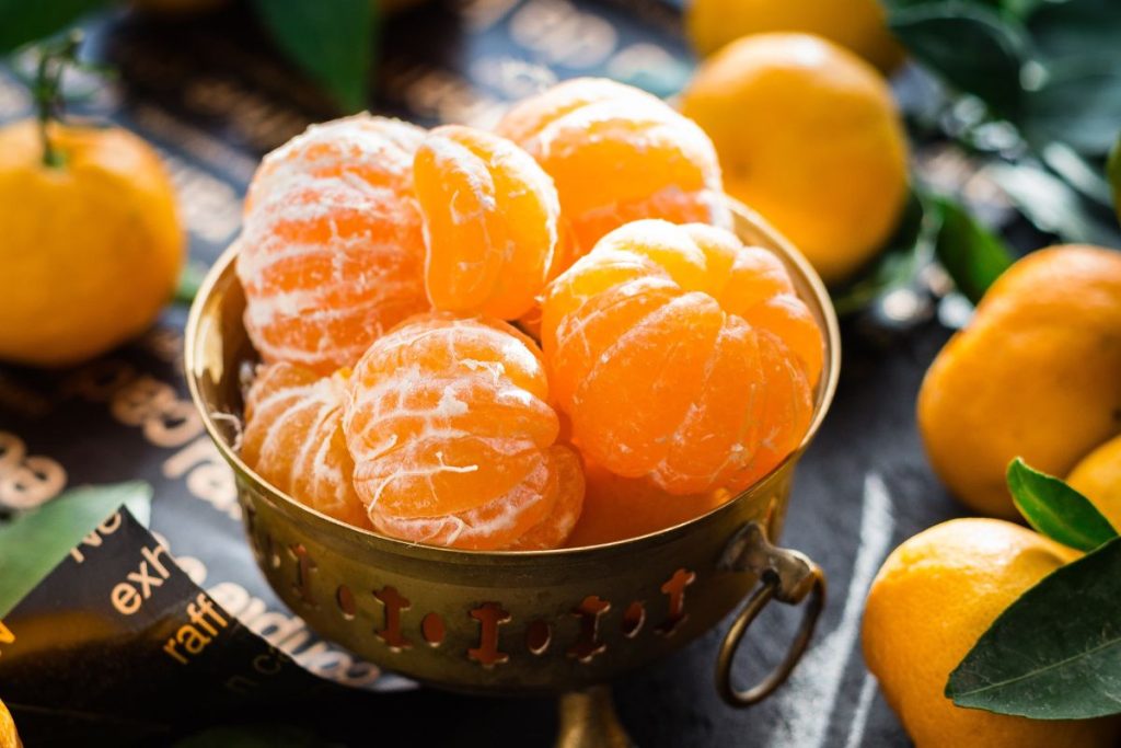 Bowl of peeled mandarin oranges with minimal pith remaining