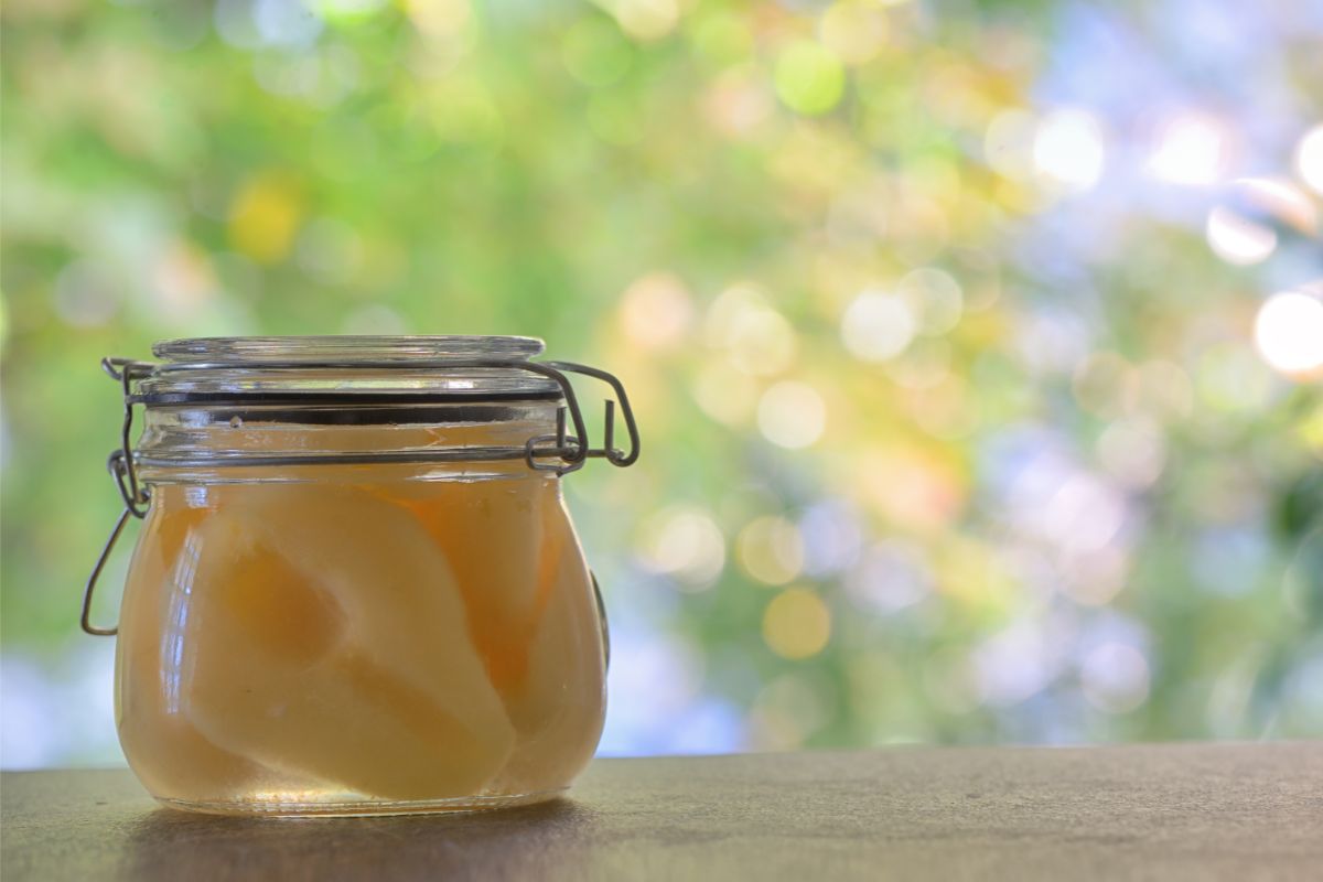 Canned pear halves in pint jar