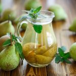 Pear quarters in water glass